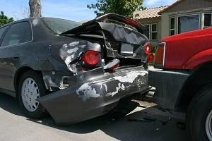 A black car wrecked due to a fatal crash who needs a Dawsonville personal injury lawyer